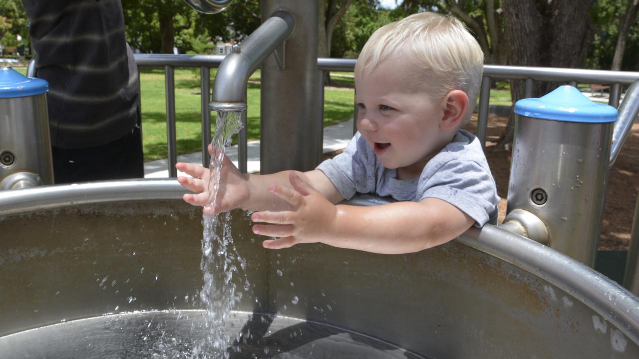 Toowoomba youngster, Frederick Tyrrell, loves splashing in the water feature at Queen's Park. Wednesday, December 29 2021. PICTURE: Morgan Burley