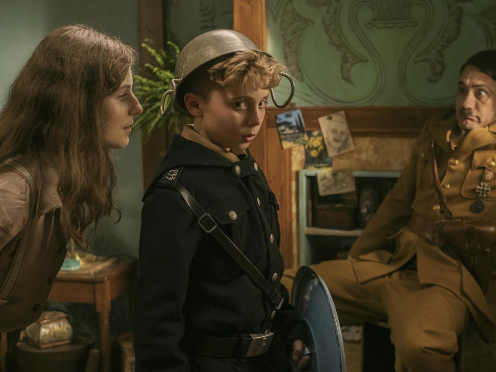 Thomasin McKenzie, Roman Griffin Davis, and Taika Waititi in Jojo Rabbit.