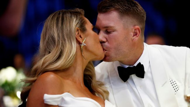 David and Candice Warner share a kiss after David is named the Allan Border Medallist.