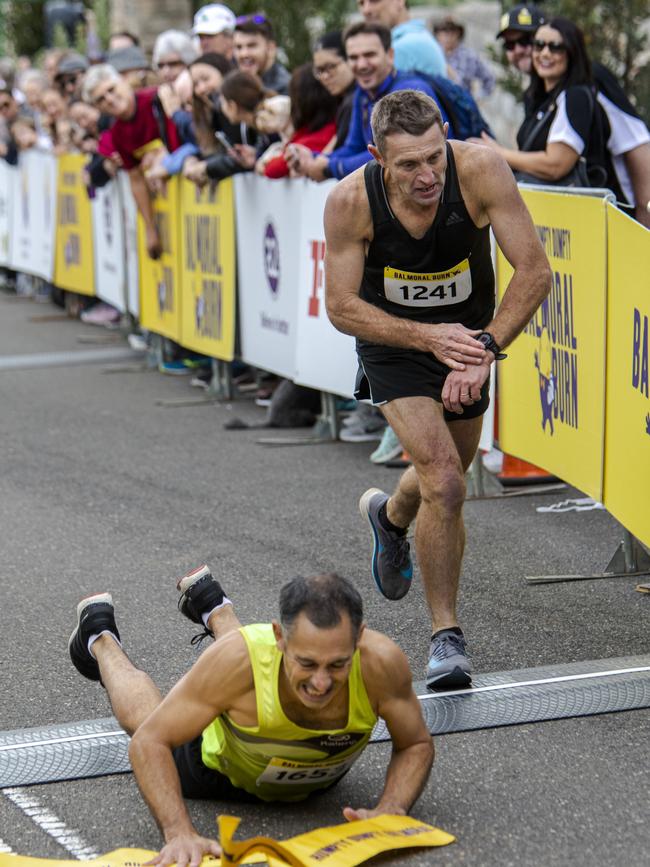 A category winner dives over the line.