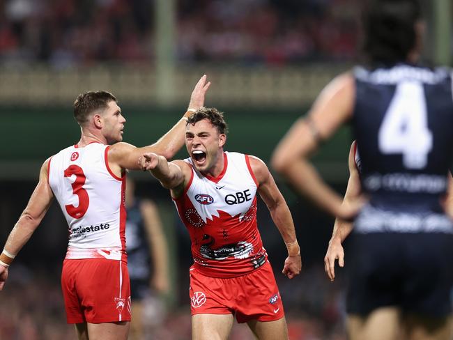 Will Hayward and Taylor Adams celebrate a Swans goal. Picture: Cameron Spencer/Getty Images