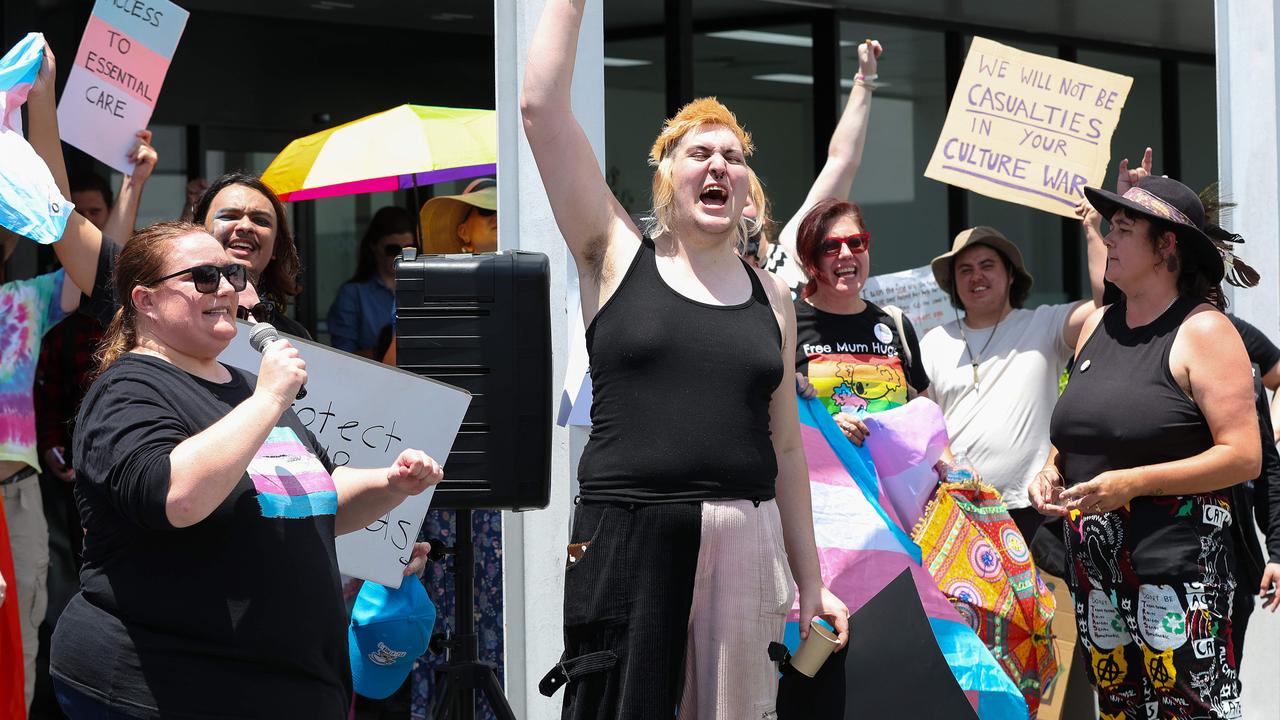 Protesters gather at Tim Nicholls Electorate office over the decision to stop puberty blockers. Pics Adam Head