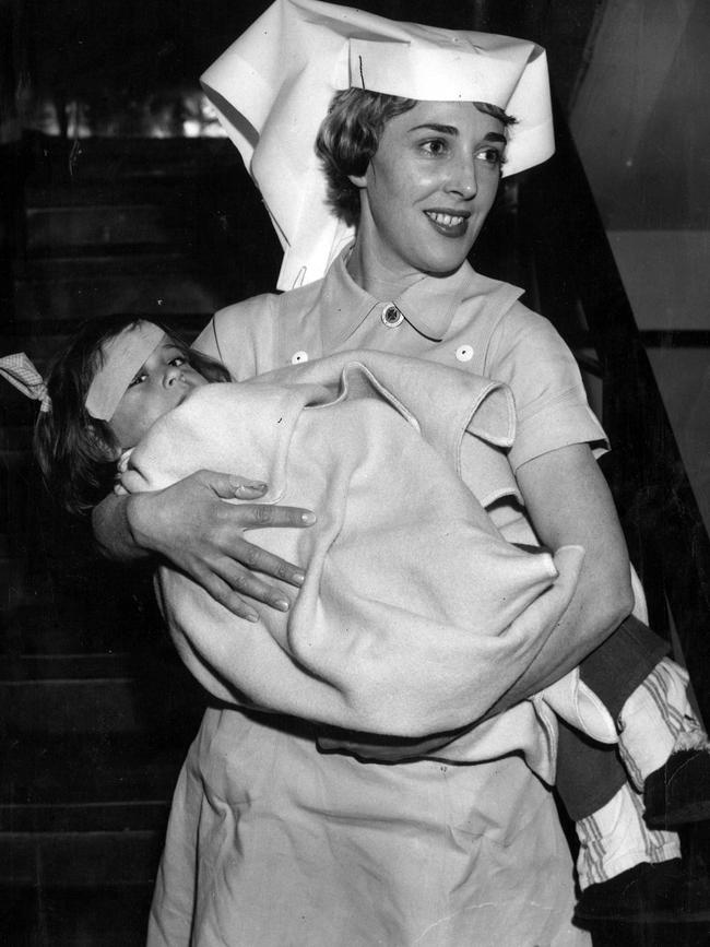 Sister Helen McEwen cuddles little Maris in 1960. Picture: The Herald