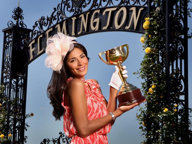 <p>Pia Miller holds the Melbourne Cup at Flemington ahead of the 2009 Spring Carnival. Picture: David Caird</p>