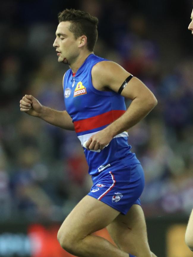 A bloodied Luke Dahlhaus leaves the ground. Picture: AAP