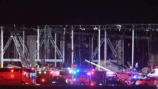 First responders surround a damaged Amazon Distribution Centre. Picture: Getty