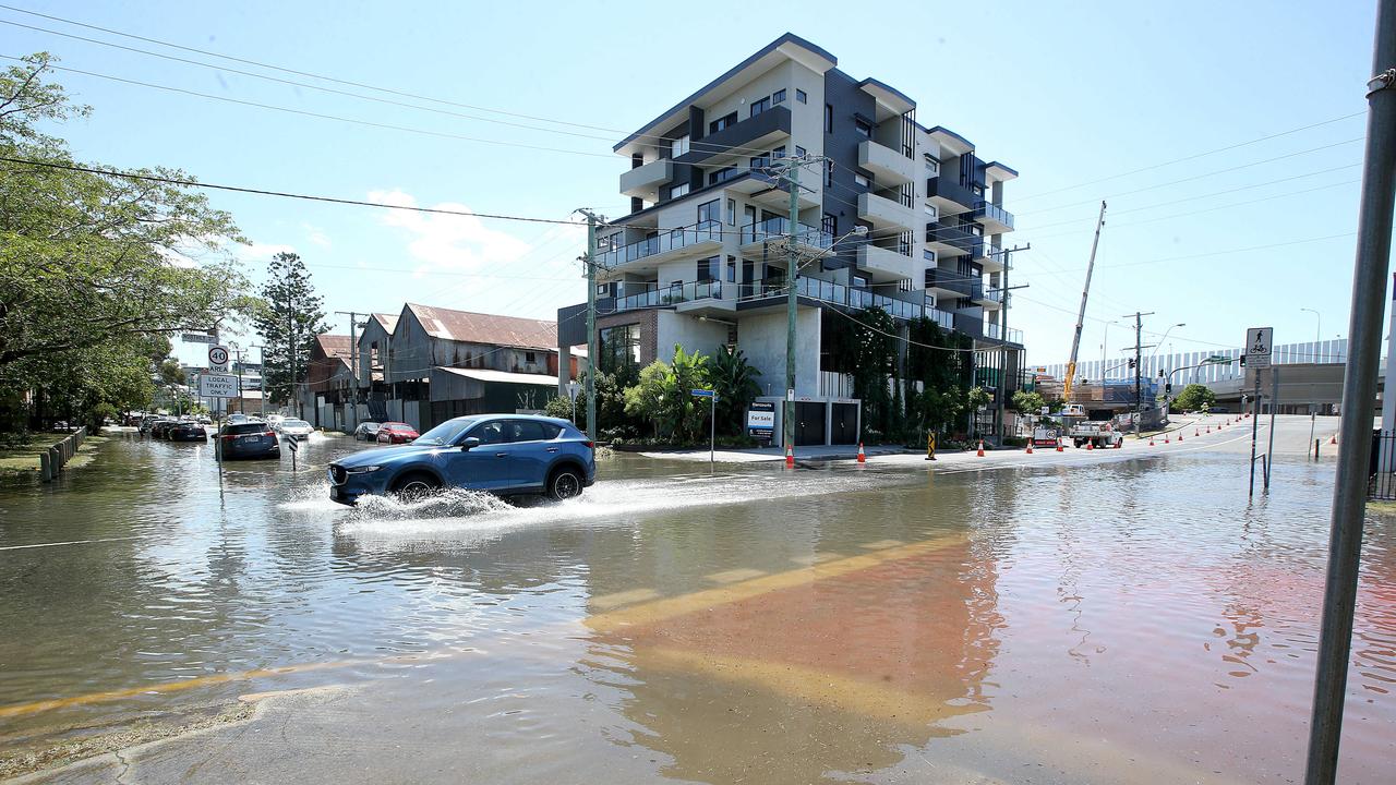 Northey Street in Windsor during local flooding from Enoggera Creek, sparked by a king tide, the supermoon and the effects of Cyclone Oma. Picture: AAP