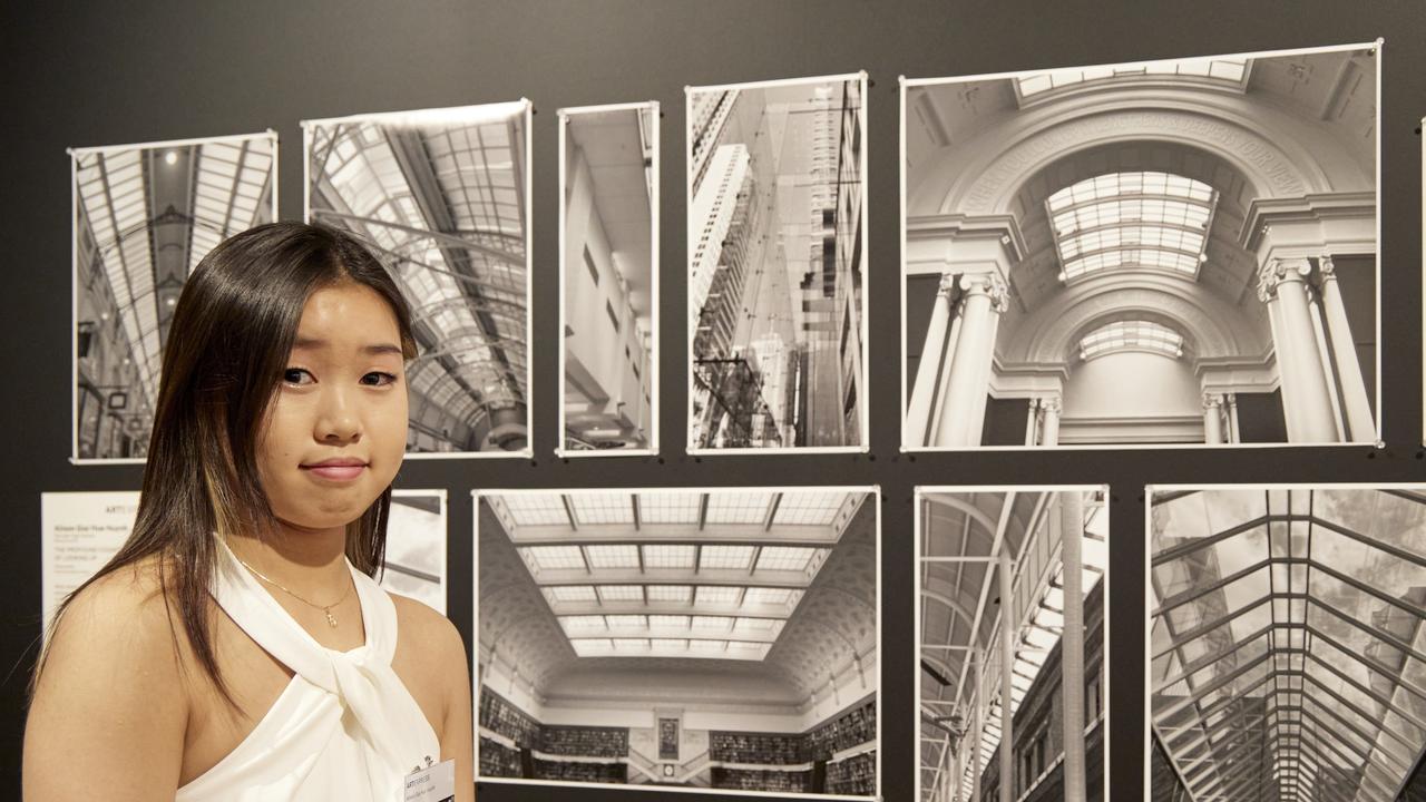 Alison Giai Hue Huynh, Fairvale High School, with her work 'The profound cognitive effects of looking up'. Picture: Mim Stirling