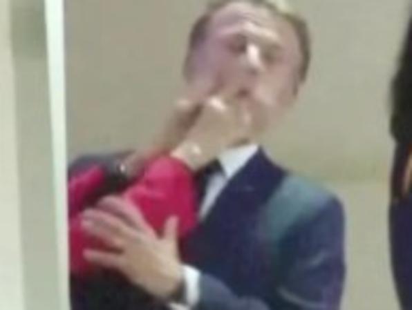 The bizarre moment French President Emmanuel Macron is slapped in the face. AP