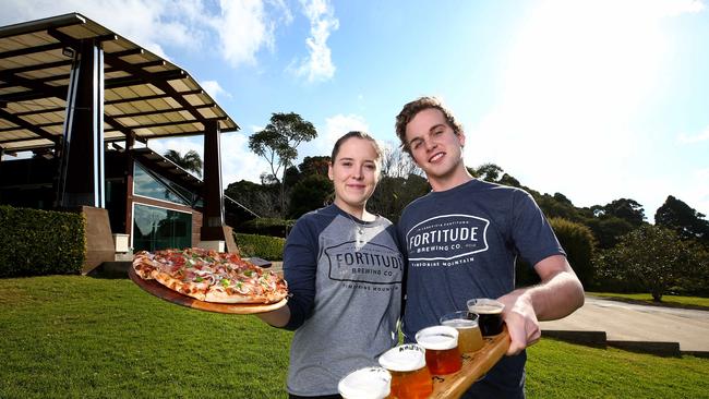 Andrew Coad and Grace Norris both from Tamborine are both happily working at Fortitude Brewing Co on Tamborine Mountain as part of a jobs boom in Queensland’s tourism industry. Picture: Adam Head