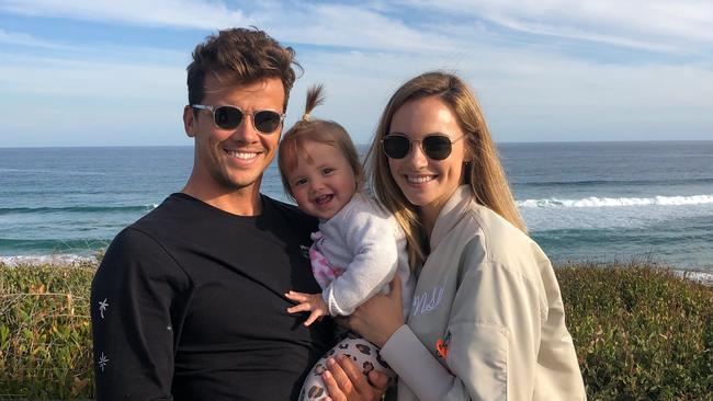 Julian Wilson with his wife Ashley and daughter Olivia.