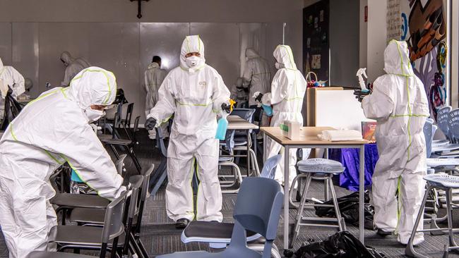 Cleaners ensure classrooms at St Christopher's Catholic Primary School are thoroughly sanitised. Picture: Monique Harmer