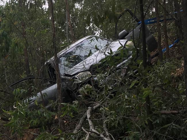 Emergency services crews at the scene of a crash at Tamborine Oxenford Road. Photo: Nicholas McElroy