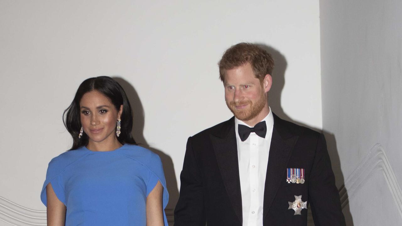 Meghan wears the earrings gifted by the Saudi Crown Prince while descending a staircase alongside a blissful-looking Harry. Picture: Getty Images