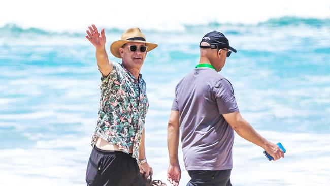 Tom Hanks enjoying a stroll along the beach in Broadbeach on the Gold Coast when he was here filming Elvis. Picture: Nigel Hallett