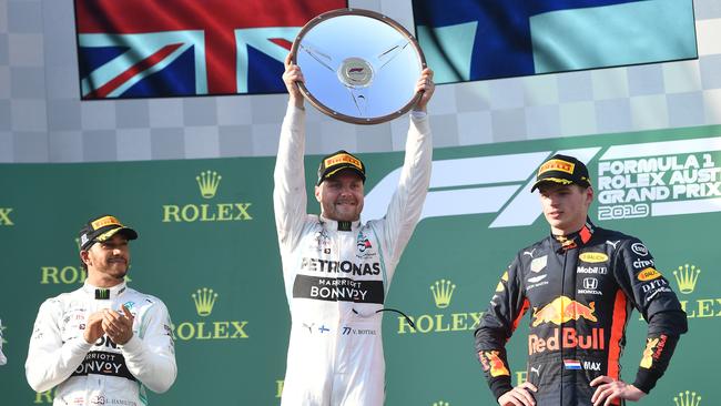 Valterri Bottas, centre, after winning the Formula 1 Australian Grand Prix in 2019. Picture: AAP