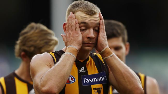 James Worpel walks off after Hawthorn's sixth loss of the season.