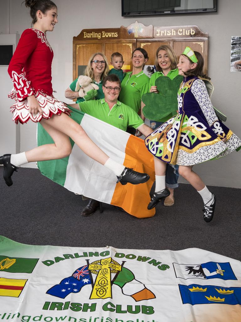 Catherine (front, left) and Sarah (front, right) McGovern help Darling Downs Irish Club committee members (back, from left) Aileen Cater-Steel, Tomas Guerin, Gillian Ross holding Arthur Ross and Mary McGovern prepare for Toowoomba's celebrations of St Patrick's Day. Picture: Kevin Farmer