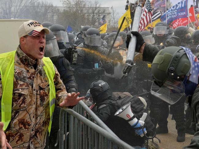 A Trump supporter screams towards police. Picture: AFP