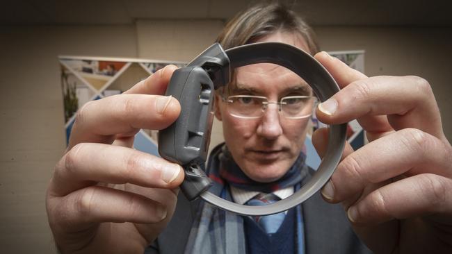 Executive Director Community Corrections Chris Carney holds an Electronic Monitoring Ankle Bracelet at Hobart. Picture: Chris Kidd