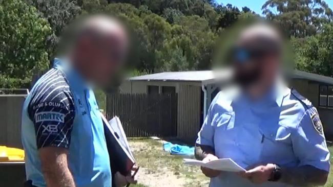 Adam James Smith at his property with police. Picture: NSW Police