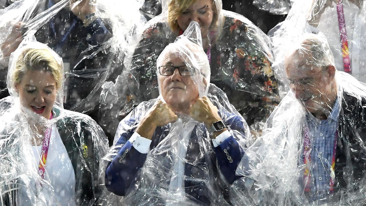 GOLD COAST, AUSTRALIA - APRIL 10: Prime Minister of Australia Malcolm Turnbull takes shelter from the rain during the swimming on day six of the Gold Coast 2018 Commonwealth Games at Optus Aquatic Centre on April 10, 2018 on the Gold Coast, Australia. (Photo by Quinn Rooney/Getty Images)