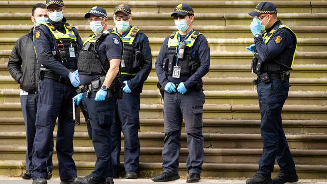 Police attend a protest outside Parliament House on Tuesday. Picture: Mark Stewart