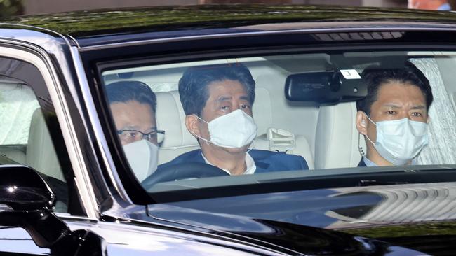 Shinzo Abe, centre, is driven to a Tokyo hospital on Monday. Picture: AFP