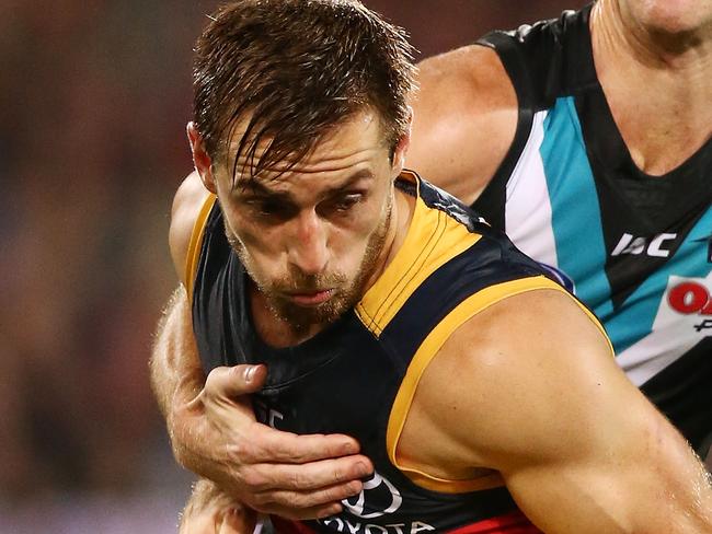 ADELAIDE, AUSTRALIA - APRIL 08: Richard Douglas of the Crows is tackled by Robbie Gray of the Power during the round three AFL match between the Port Adelaide Power and the Adelaide Crows at Adelaide Oval on April 8, 2017 in Adelaide, Australia.  (Photo by Morne de Klerk/Getty Images)