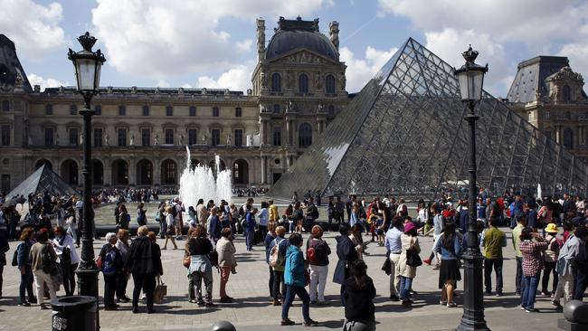 Tourists wait in line to visit the Louvre museum. Picture: Thibault Camus/AP