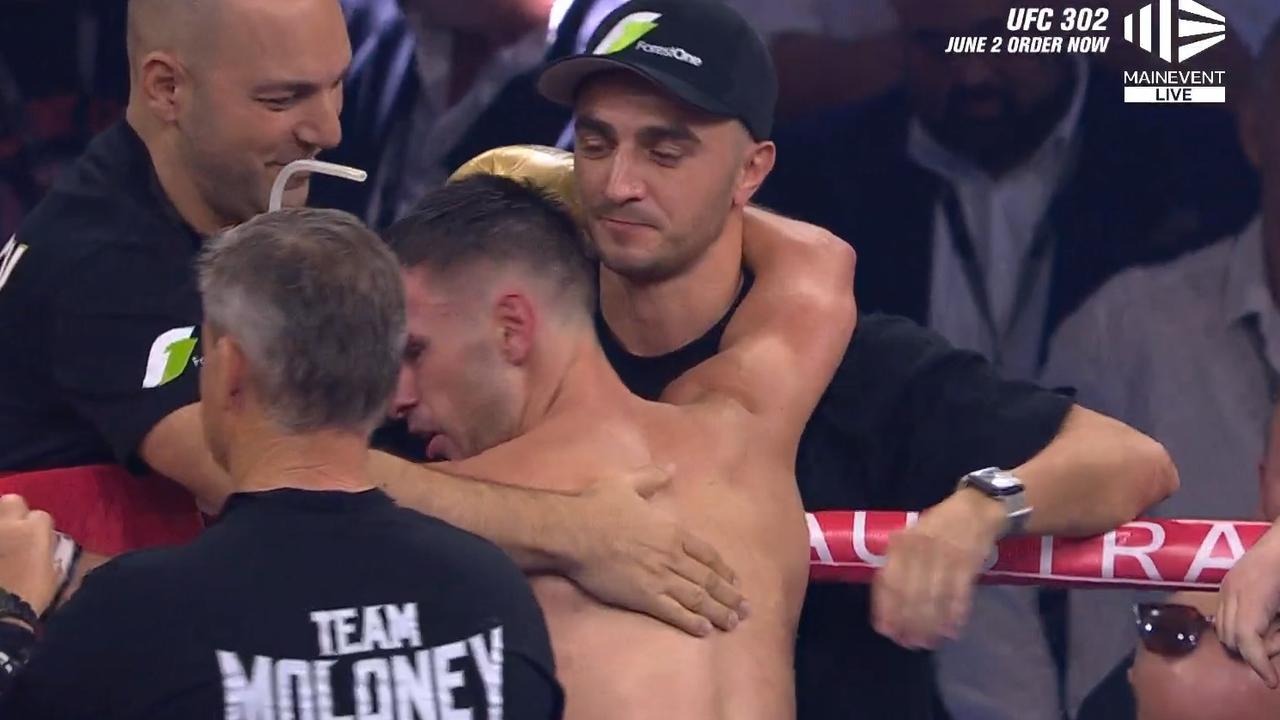 Andrew Moloney is embraced by brother Jason. Photo: Main Event.