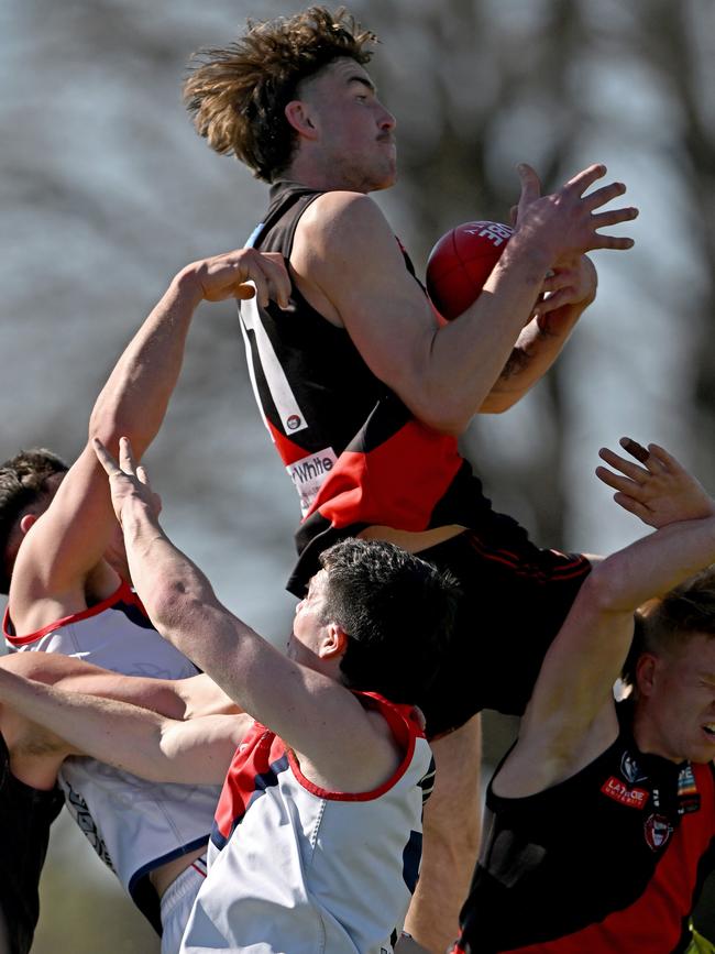 Finnbar Maley crashes the pack for Eltham. Picture: Andy Brownbill