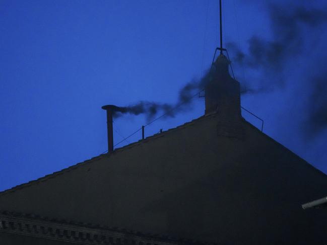 Black smoke billows from the chimney of the Sistine Chapel. Picture: AP Photo