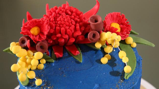 The Australia Day-themed caked is topped with a waratah and gum nuts made out of fondant and sprinkled with edible glitter.