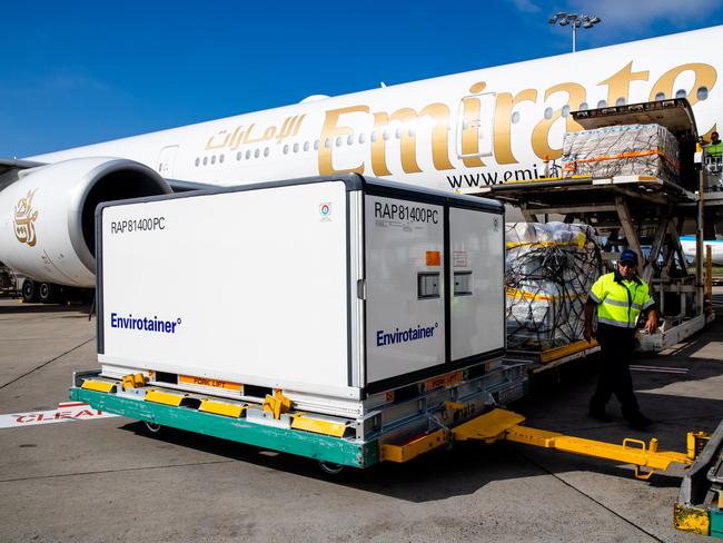 A container with the AstraZeneca COVID-19 vaccines is removed from the Emirates airlines plane after landing in Sydney. Picture: Edwina Pickles – Pool/Getty Images