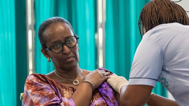 Struggling African national Rwanda has a slightly higher vaccination rate than Australia. Here Jeannette Kagame, the president’s wife, gets her shot. Picture: AFP