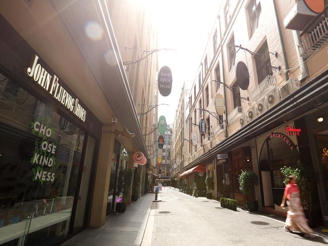 MELBOURNE, AUSTRALIA - FEBRUARY 13: Degraves Street is seen deserted on February 13, 2021 in Melbourne, Australia. Victoria is in stage 4 lockdown from as of midnight for five days following the confirmation of new COVID-19 cases of the UK virus strain in the community linked to the Holiday Inn quarantine hotel. Victorians are only able to leave their homes for essential shopping, caregiving, essential work or permitted education, or exercise for two hours per day with household members only. People must stay within a 5km radius of home. The stage 4 restrictions are due to end at 11:59pm on Wednesday 17 February. (Photo by Robert Cianflone/Getty Images)