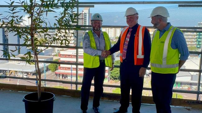 Halikos Group's managing director Shane Dignan, Professor Scott Bowman and Assistant Education Minister Senator Anthony Chisholm with the ceremonial tree. CDU CBD campus