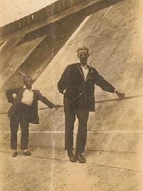 Two men demonstrate the steep banking of the Motordrome track. Picture: HWT Library