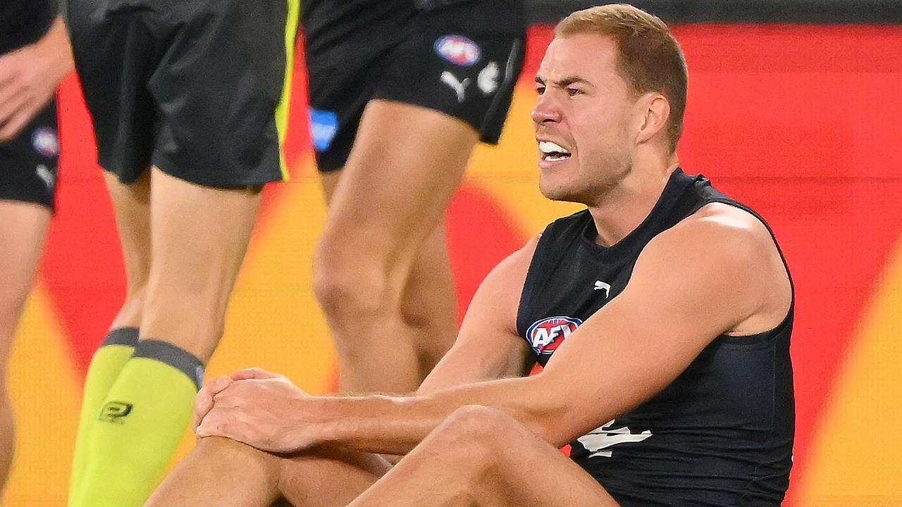 MELBOURNE, AUSTRALIA – JULY 15: Harry McKay of the Blues reacts to an injury during the 2023 AFL Round 18 match between the Carlton Blues and the Port Adelaide Power at Marvel Stadium on July 15, 2023 in Melbourne, Australia. (Photo by Morgan Hancock/AFL Photos via Getty Images)