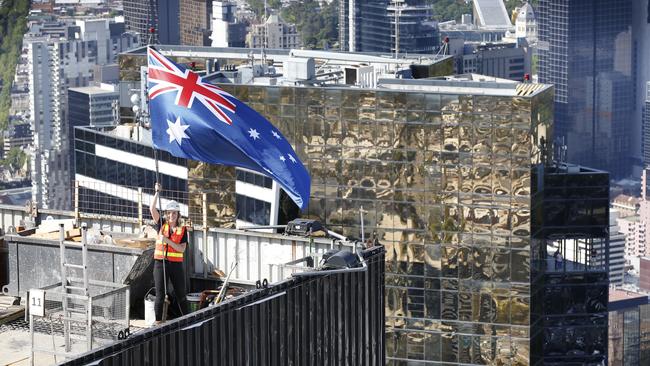 Project co-ordinator Stephanie Kluz on top of the lift core of Australia 108 with Eureka Tower in the background. Picture: David Caird