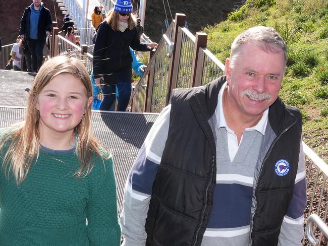 The impressive new Hallett Cove Coastal Walkway Bridges officially opened Saturday 3 August 2024 from Grey Road to Fryer Street.Locals, Leo Van Vught and his grand daughter Sophie,10,(green top), and her friend Skylah,10, and close neighbour, Kirsty Duncan with her dog Baxter, love the new bridges. 3 August 2024. Picture: Dean Martin