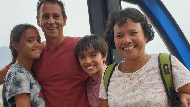 (L-R) Anisah Keegan, 13, with dad Tony, brother Kazhim, 11, and mum Nurk riding the Scenic Cableway in Katoomba. Picture: Isabell Petrinic