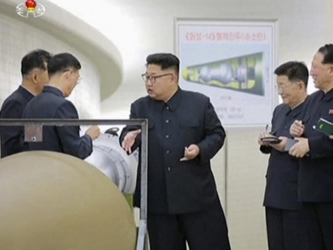 Kim Jong-un (centre). Picture: KRT via AP Video