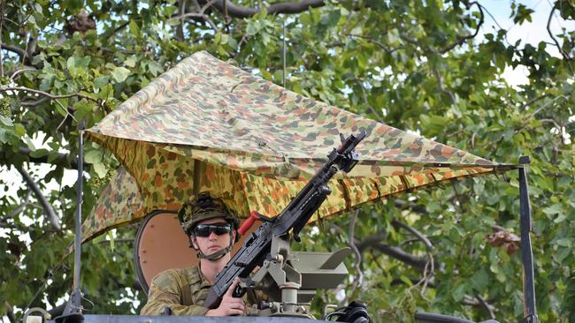 A Bushmaster gunner protects the entrance to Ingham Aerodrome in Queensland during war games. Picture: Cameron Bates