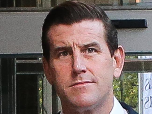 SYDNEY, AUSTRALIA - NewsWire Photos -MARCH 22 2022: Ben Roberts-Smith is seen leaving the Federal Court in Sydney. Mr Roberts-Smith is suing three former Fairfax newspapers over articles he says defamed him in suggesting he committed war crimes in Afghanistan between 2009 and 2012. Picture NCA Newswire/ Gaye Gerard