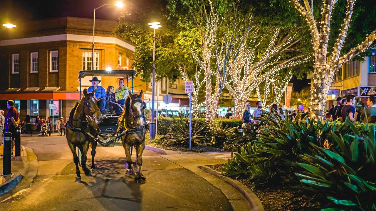 A horse and carriage navigates the intersection at the Fiveways during one of the regular celebrations in Mary Street. Picture: Leeroy Todd