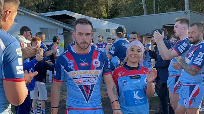 Kendyll Fahey and Imohgen Alo leading the team out onto the ground on Sunday. Picture: supplied