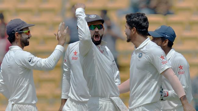 Kohli celebrates Smith’s dismissal with gusto. AFP Photo
