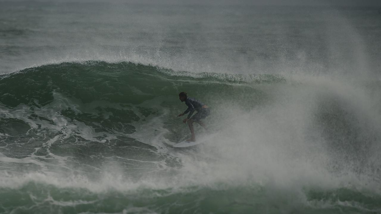 Surfers have risked riding the dangerous and unpredictable swell in northern NSW. Picture: NewsWire/Glenn Campbell